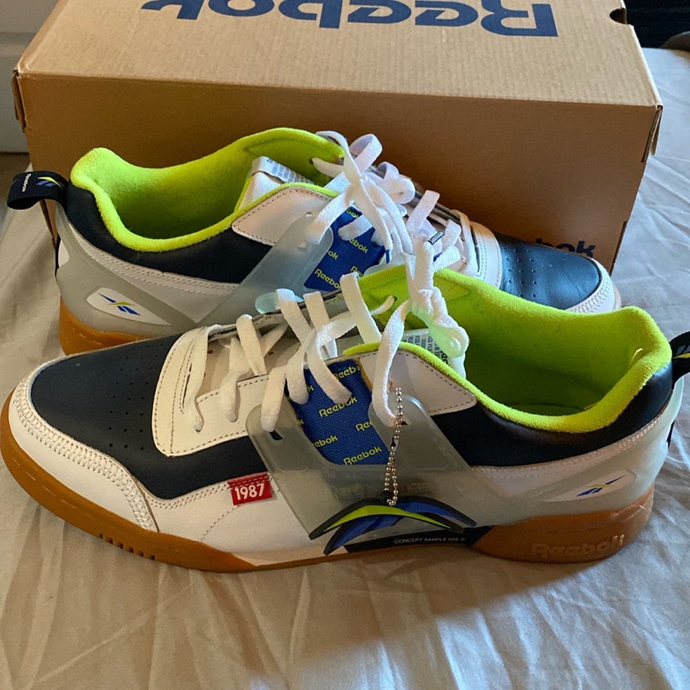 Reebox, size 13, color white, blue, and tennis ball.